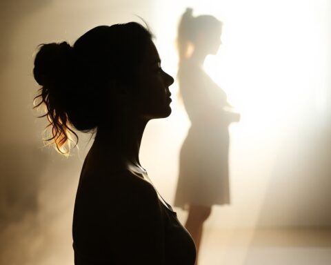 Silhouetted therapy session with backlighting, soft dreamy atmosphere, hazy soft light source behind the subject